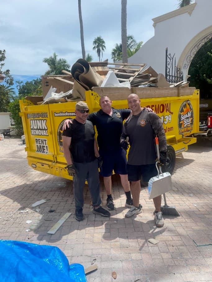 Sunshine State Junk Removal crew with a loaded 24-yard dump trailer after a construction debris cleanout in Boca Raton, Florida